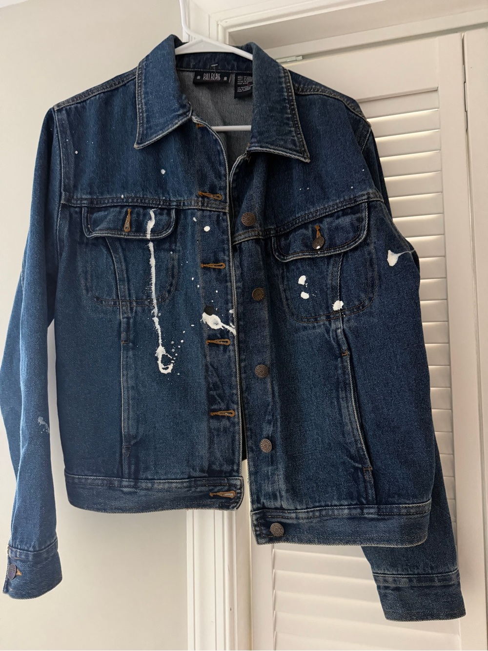 Vintage Bill Blass blue denim jacket with white paint splatters, size M.